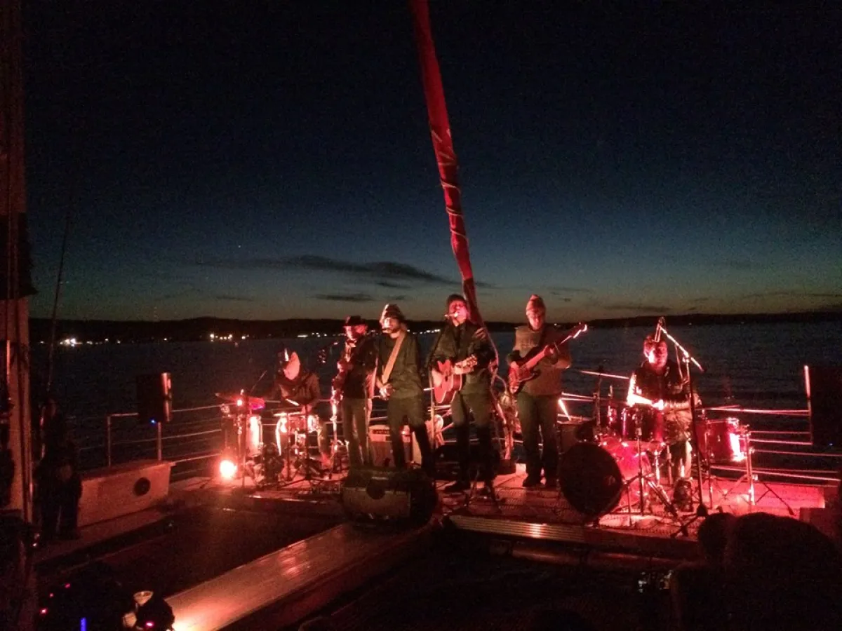 A band playing on the Nauti-Cat