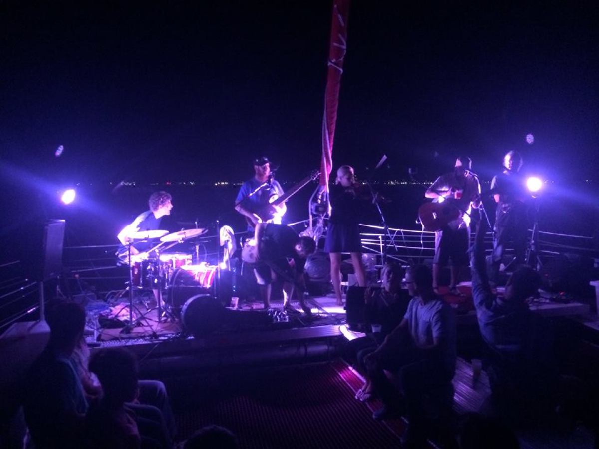 A band playing on the Nauti-Cat