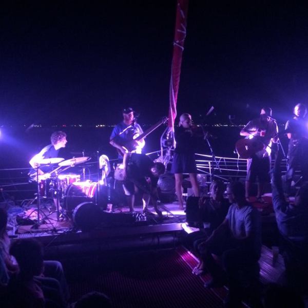 A band playing on the Nauti-Cat