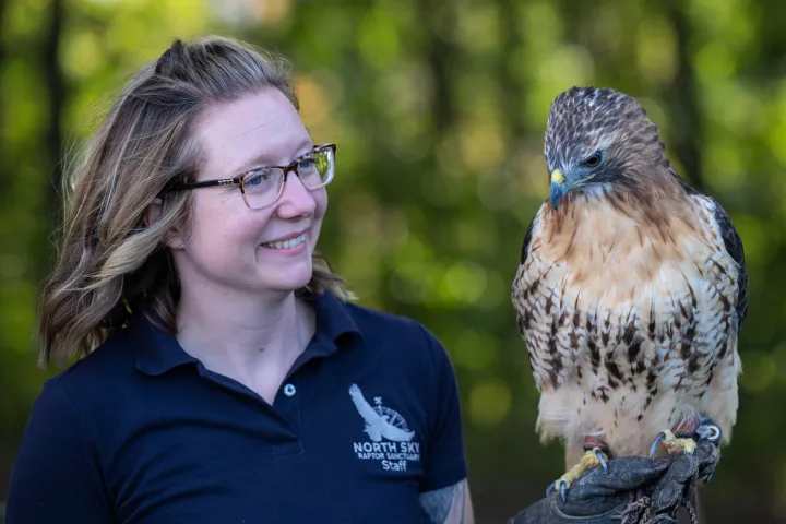 a person holding a bird
